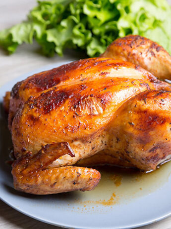 Spicy Lemon-Herb Whole Roasted Chicken and Vegetables 5 whole roasted chicken on a plate recipe roast chicken image2