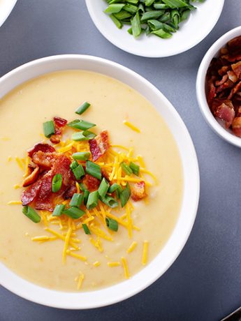 The Best Creamy Loaded Potato Soup Recipe: A Comforting Dish for All Seasons 1 Potato cream soup with-bacon, green onion and cheese overhead Easy Potato Soup Recipe, How to Make Loaded Potato Soup, Creamy Potato Soup with Cheese